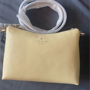 Kate Spade outlet yellow cross body purse.